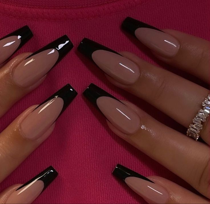 Chic Nude and Black Nail Design: Elegant Elongated Shape with Striking Contrast.