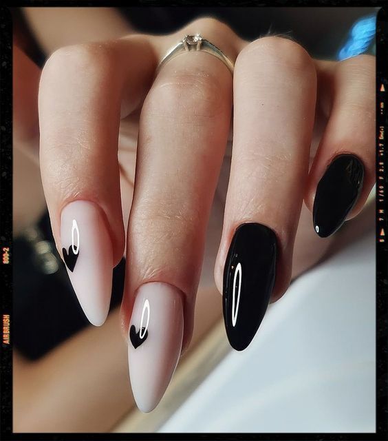 Elegant Matte and Glossy Black and White Heart-Themed Nail Design