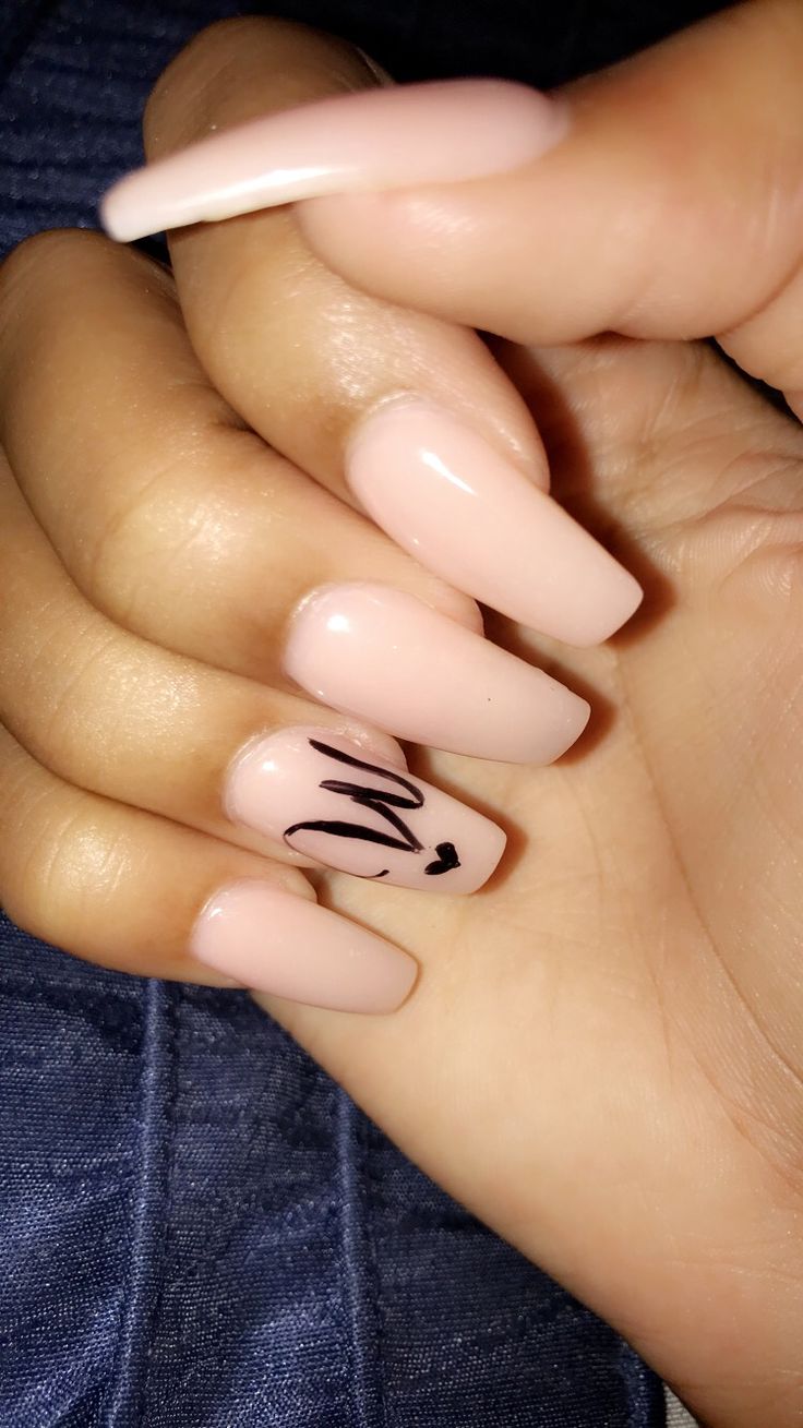 Chic Nude Nails with Playful Black Accent for Elegant Contrast.