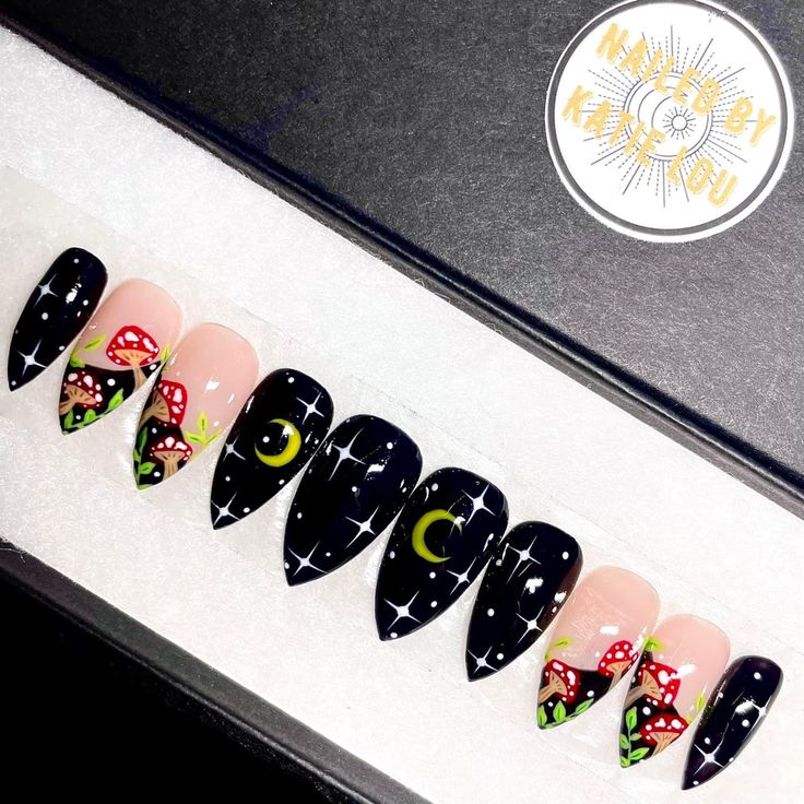 Whimsical Nighttime Nail Art: A Bold Blend of Dark and Pastel Shades with Mushroom and Star Illustrations.