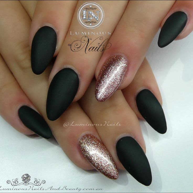 Chic Elegant Matte Black Almond Nails with Sparkling Rose Gold Accent.