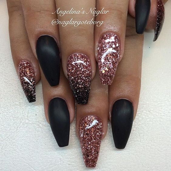 Elegant Stiletto Nail Design with Matte and Glitter Finishes in Rich Dark Tones and Sparkling Rose Gold Accents.