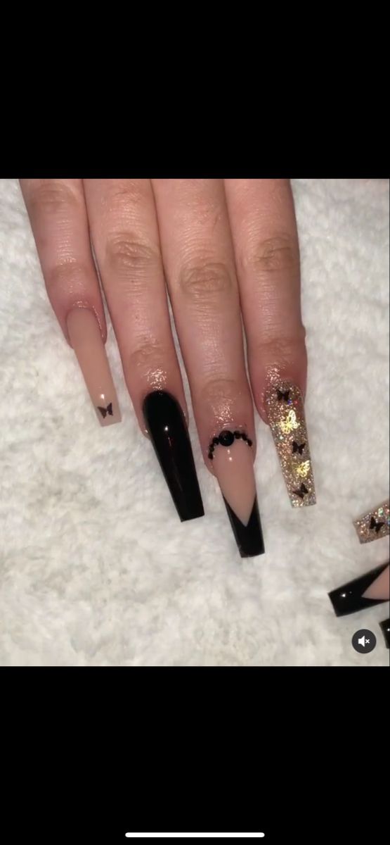 Chic Nail Design: Glossy Black, Nude, and Sparkling Gold Accents with Intricate Details.