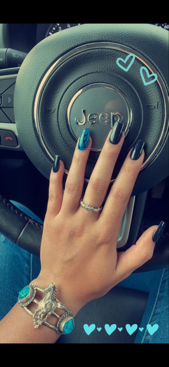 Chic Glossy Black Nail Design with Striking Blue Accent for a Modern Statement.