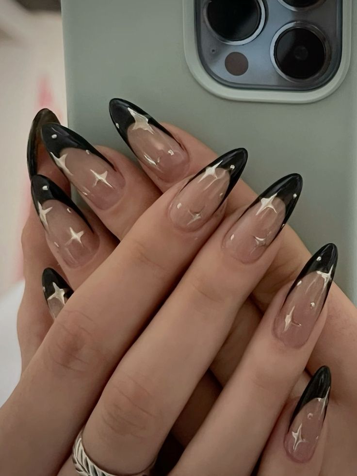 Elegant Ombre Stiletto Nails with Glamorous Star Designs: A Sophisticated and Bold Look for Any Occasion.