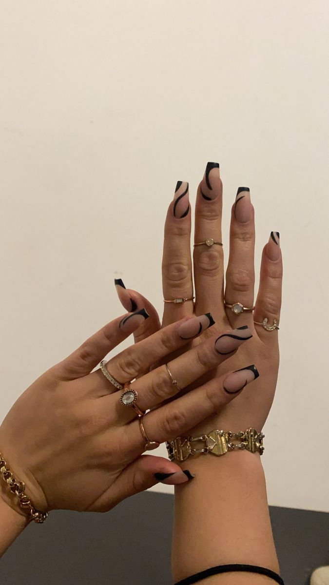 Chic Matte Black-Tipped Nail Design: A Modern Elegance with Intricate Line Art.