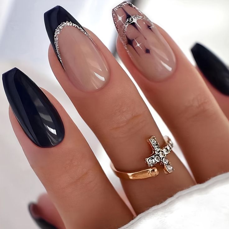 Chic Nail Design: Dark Glossy Black Meets Elegant Nude with Intricate Details.