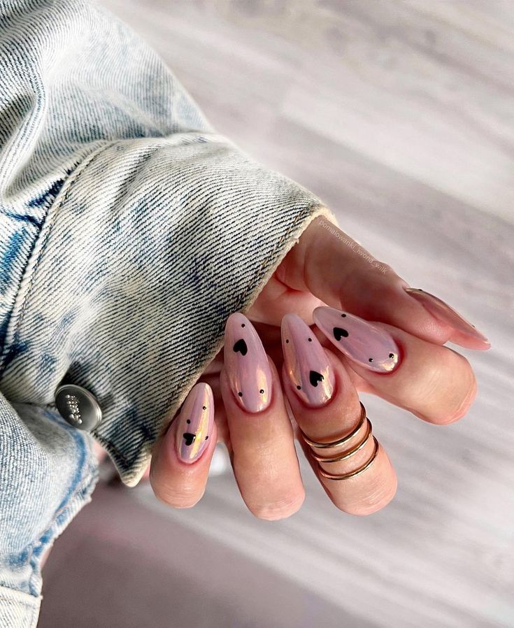 Chic Heart-Inspired Nail Design: Soft Pink Base with Elegant Black Accents and Gradient Finish.