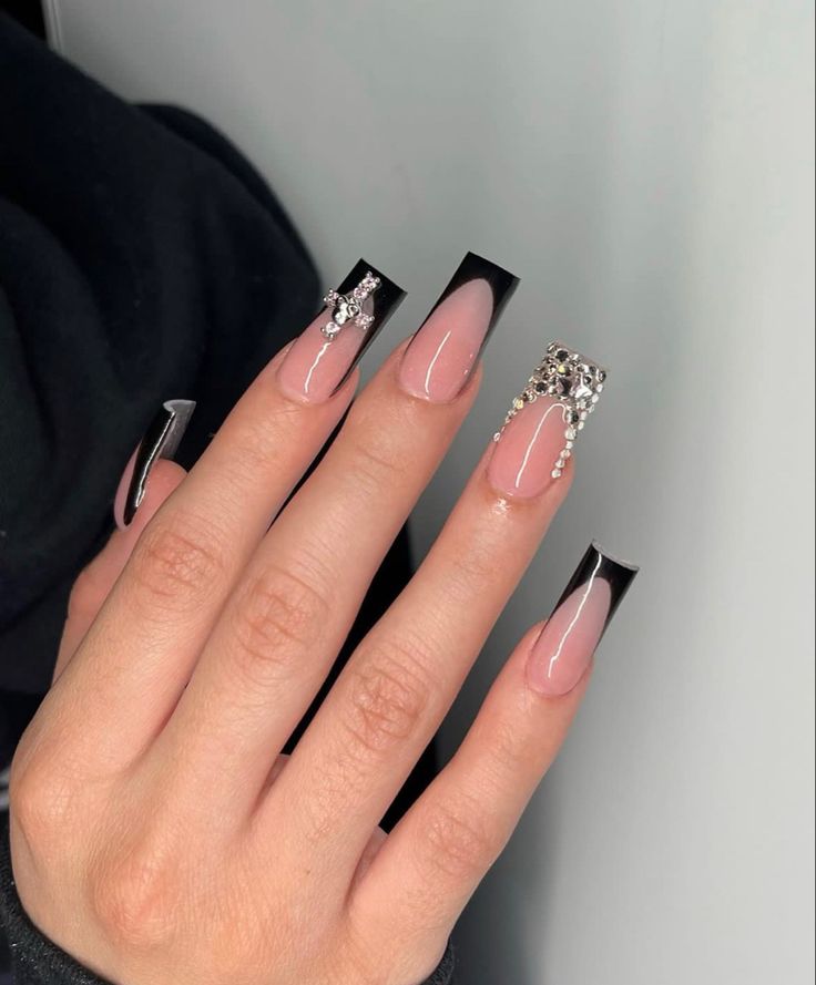 Chic Coffin-Shaped Black French Manicure with Rhinestone Accents for Glamorous Elegance.