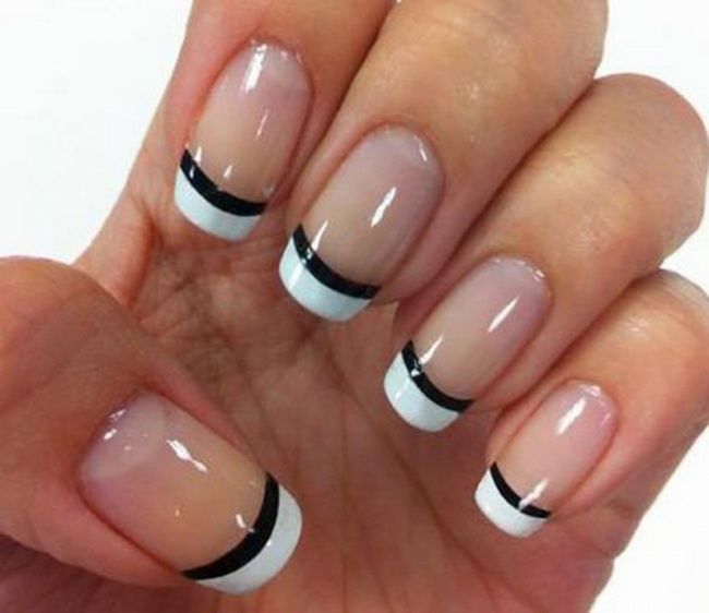 Elegant Chic French Manicure with Bold Black and White Stripes and Modern Detailing