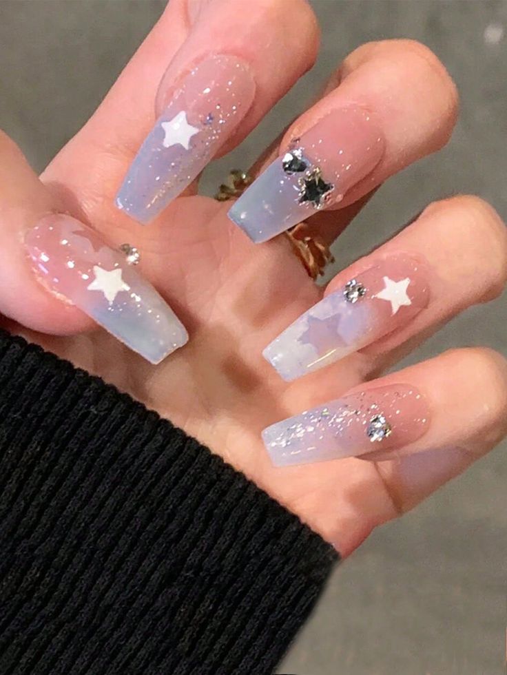 Celestial Charm: Glamorous Glittery Star-Themed Ombre Acrylic Nails