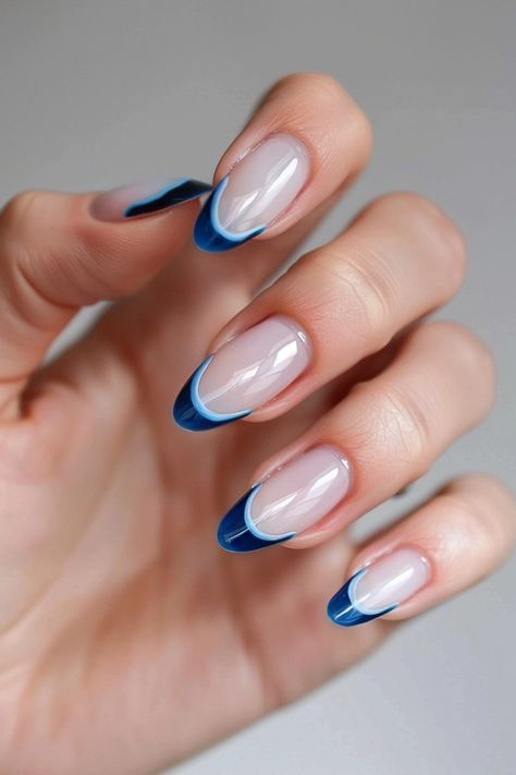 Elegant Blue and White Accent Manicure: A Modern Twist on Classic French Tips.