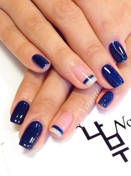 Chic Navy Blue Nail Design with Elegant Accent Striping