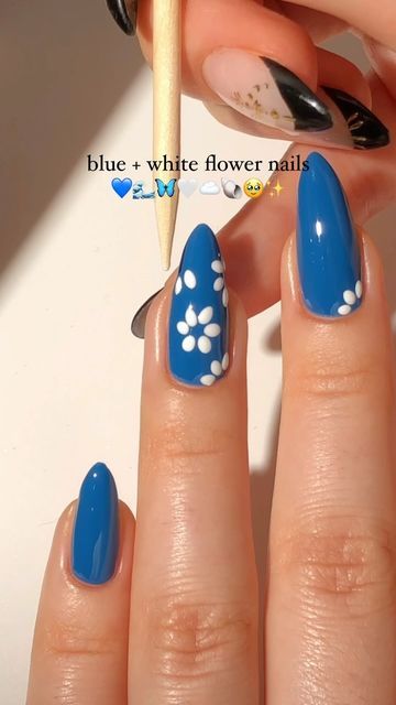 Charming Blue Floral Nail Design: A Playful and Creative Expression.