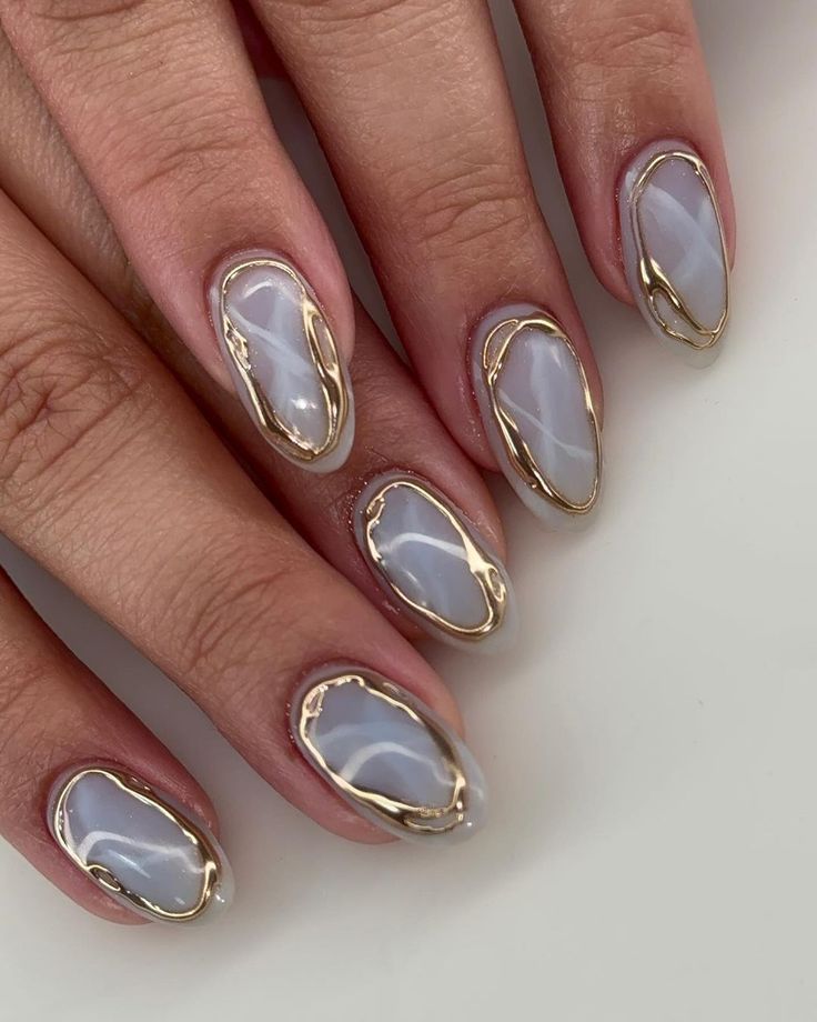 Sophisticated Gray Nails with Glossy Finish and Gold Accents.