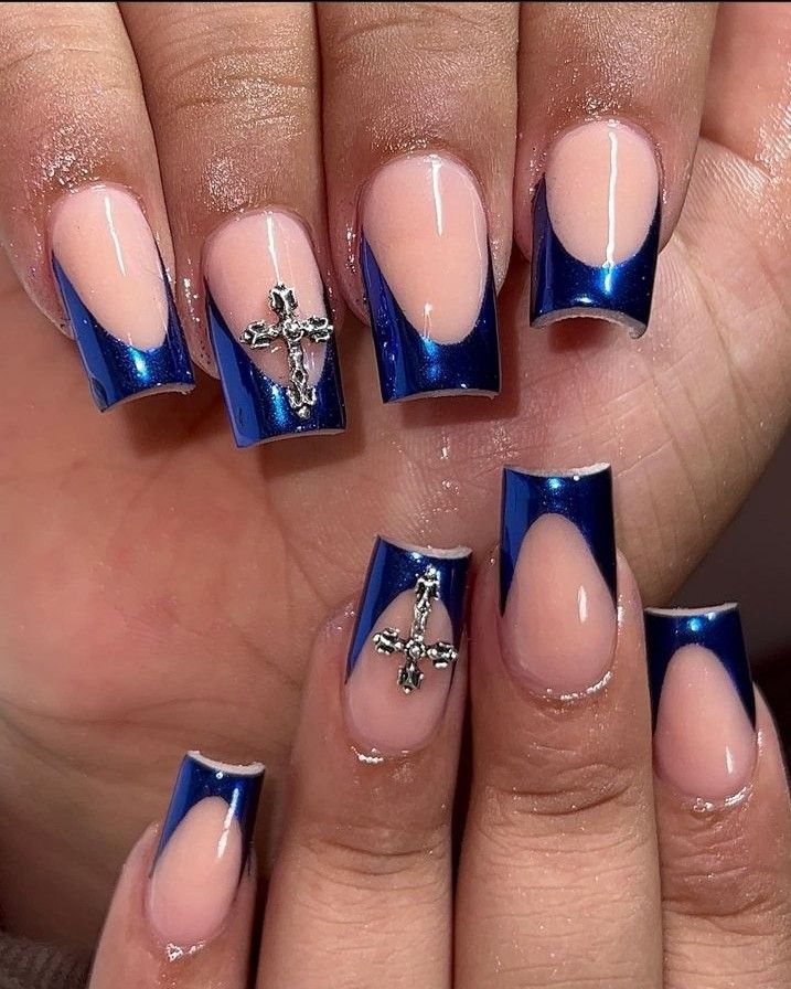 Modern French Tip Nail Design: Glossy Blue with Metallic Accents.