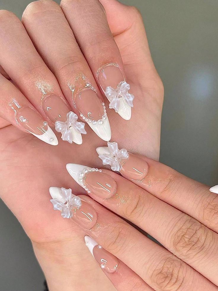 Chic Floral Nail Design with Elegant Clear, White, and Gold Accents.