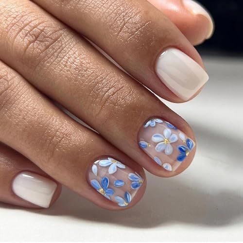 Charming Floral Nail Design: Delicate Blue and White Accents for a Fresh Spring Look.