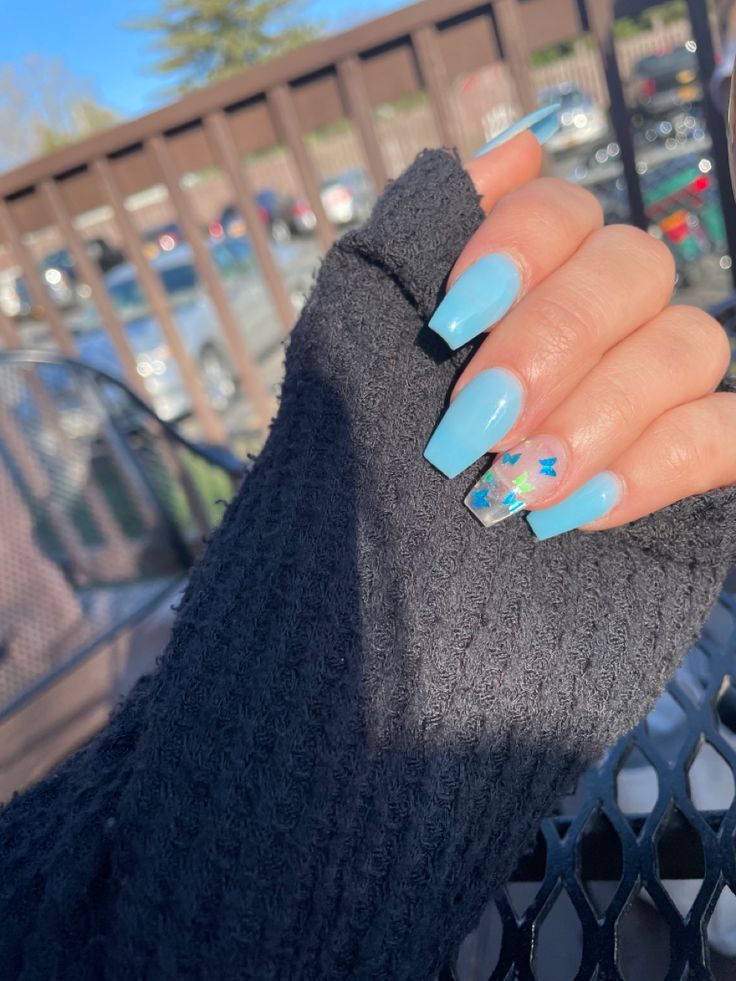 Elegant Pastel Blue Square Nails with Playful Star Accents