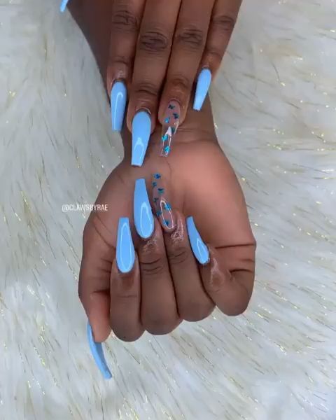 Elegant Light Blue Nail Design with Playful Patterns and Colorful Accents