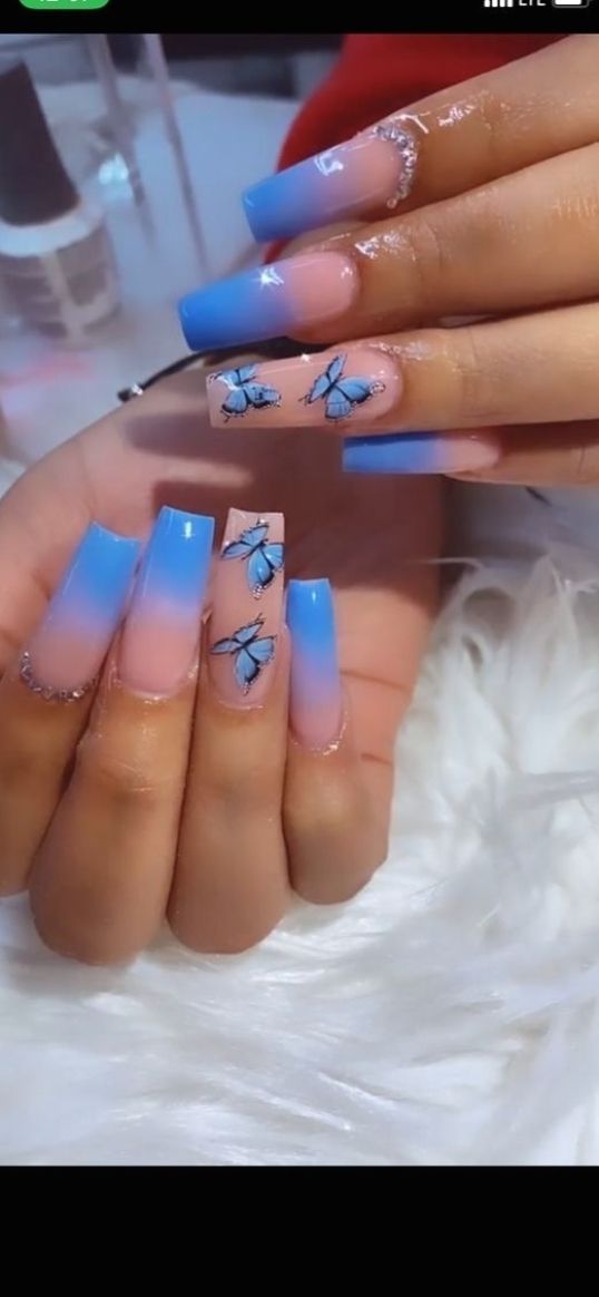 Pastel Ombre Nail Design with Whimsical Butterfly Art for a Chic Look.