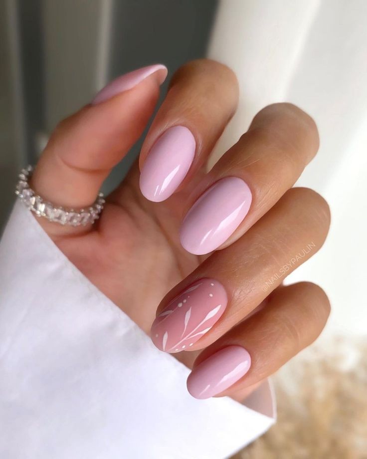 Elegant Glossy Pink Nail Design with Artistic Floral Accent