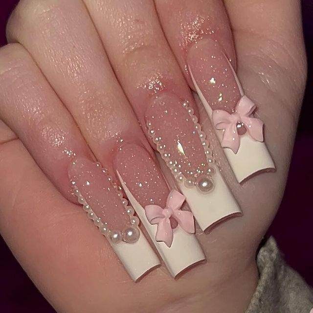 Elegant Long Nails with Sheer and Opaque Designs, Adorned with Pink Bows and Pearls.