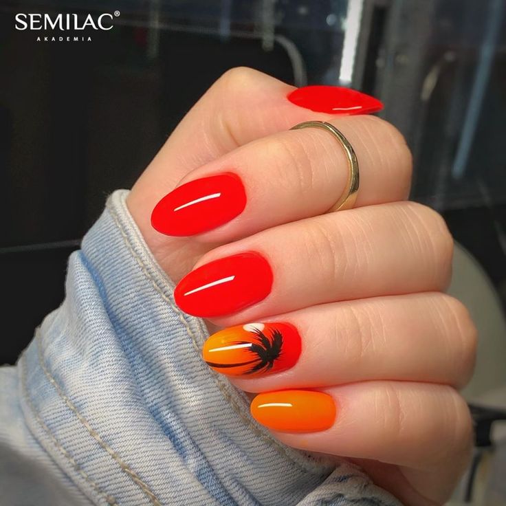 Tropical-Inspired Summer Manicure with Vibrant Red and Orange Nails and Glossy Palm Tree Accent.