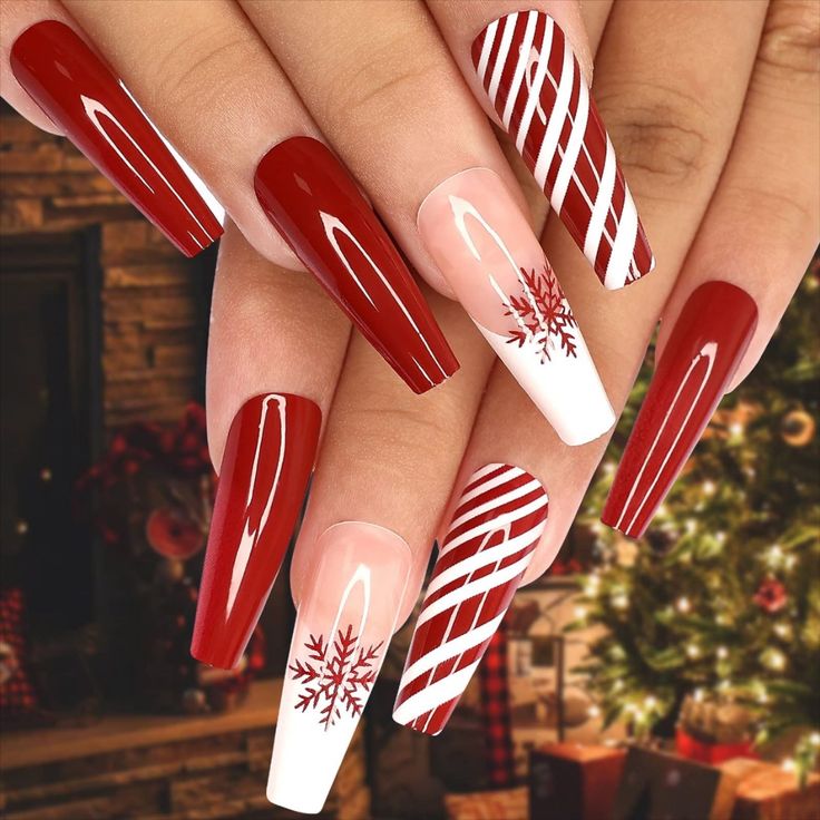 Cheerful Festive Nail Design: Rich Red & Crisp White with Candy Cane Stripes and Snowflake Motifs.