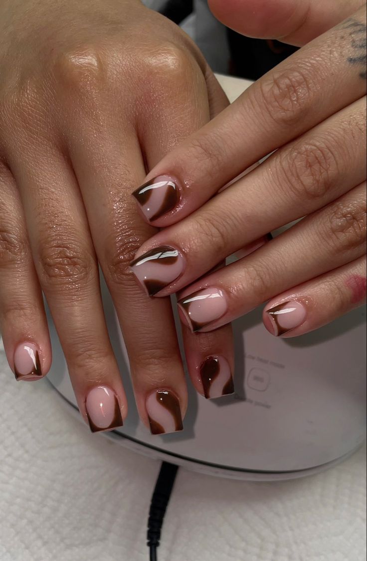 Chic Earthy Nail Design with Geometric Patterns in Soft Pink and Rich Brown.