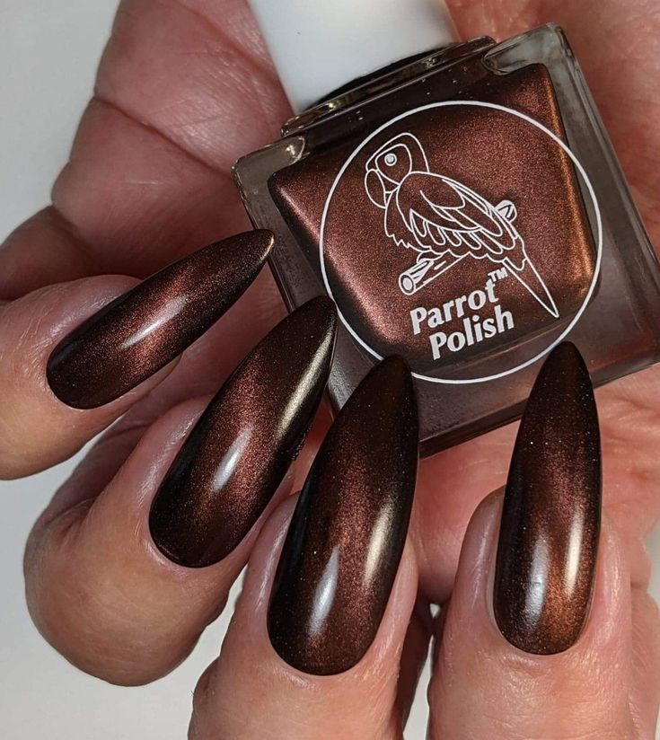 Elegant Metallic Brown Almond-Shaped Nails: A Striking Statement of Sophistication.