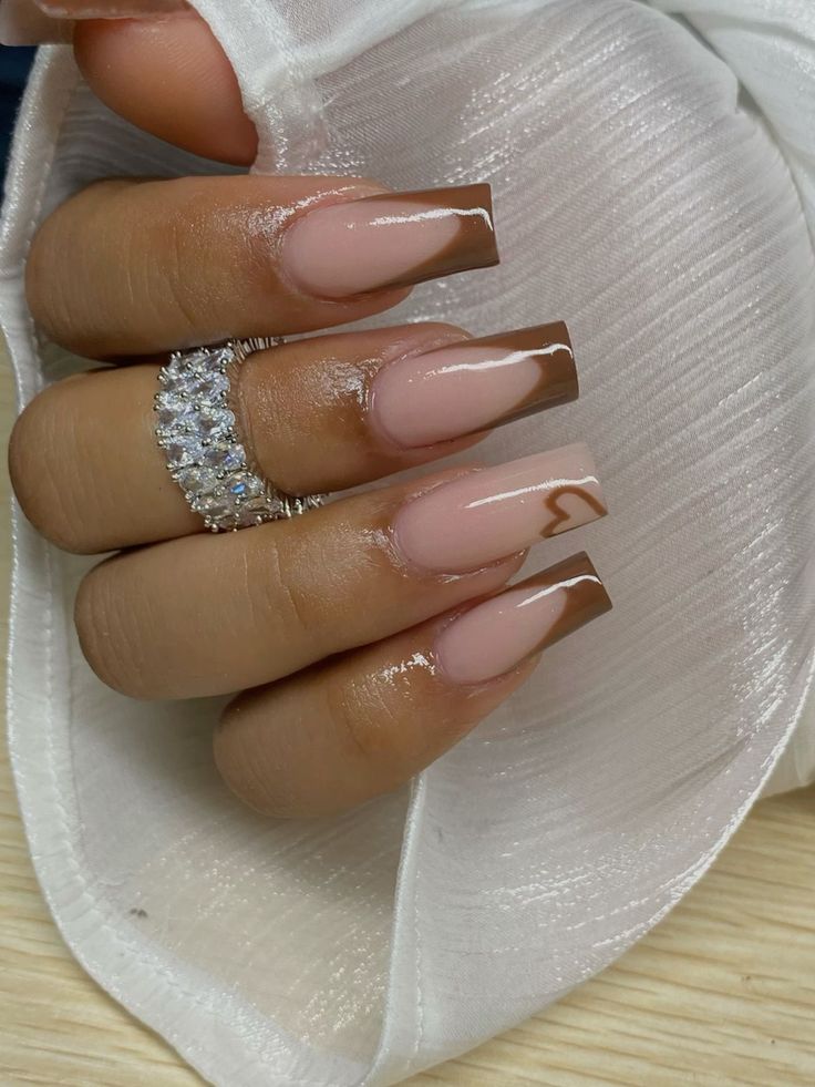 Chic Brown-Tipped Nude Nails: A Sophisticated Yet Playful Manicure.