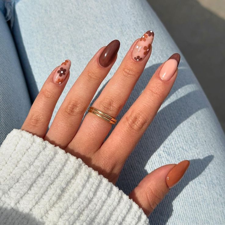 Chic Almond-Shaped Nail Design: Earth Tones with Whimsical Floral Accents