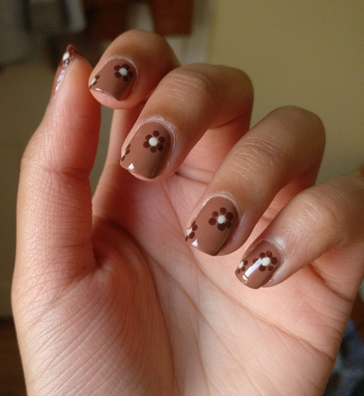 Charming Floral Nail Design with Warm Brown Base for a Stylish Look