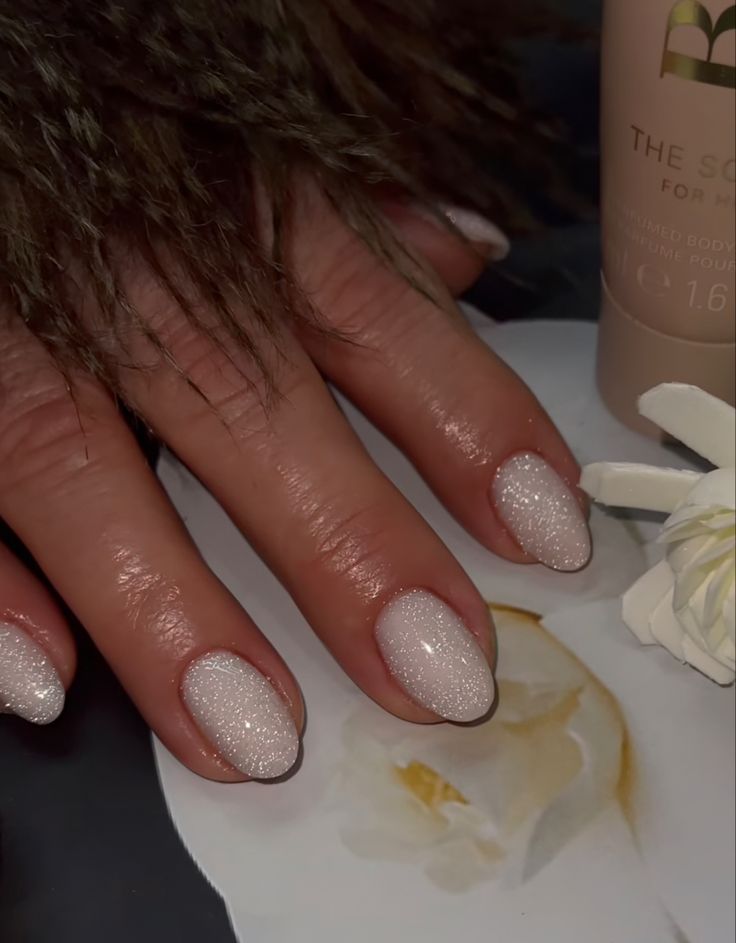 Elegant Sparkling Nail Design with Subtle Glitter Transition for Sophisticated Appeal