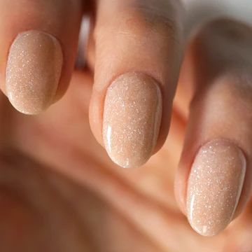 Elegant Glittery Nude Nail Design: A Subtle Touch of Glamour for Any Occasion.