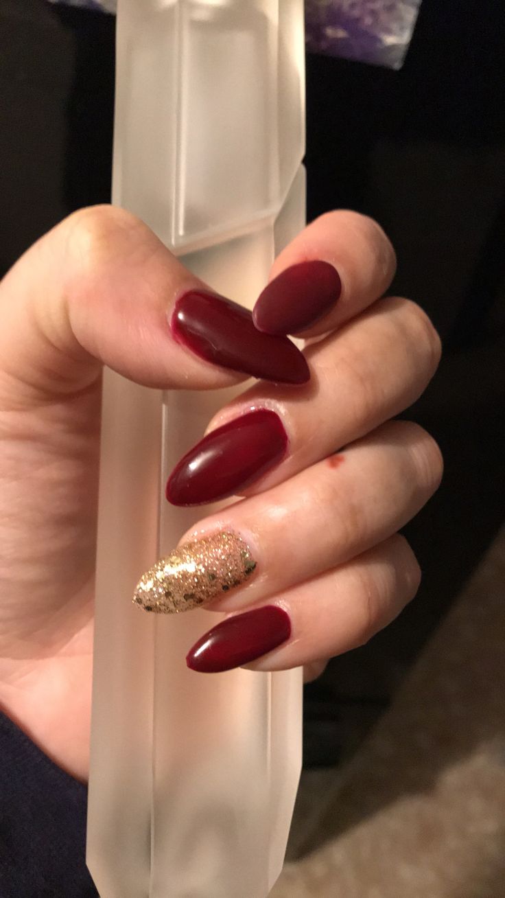 Chic Deep Burgundy and Glittering Gold Nail Design for Any Occasion.