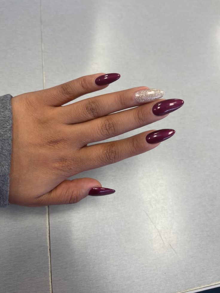 Sophisticated Burgundy Almond Nails with Shimmering Silver Accent