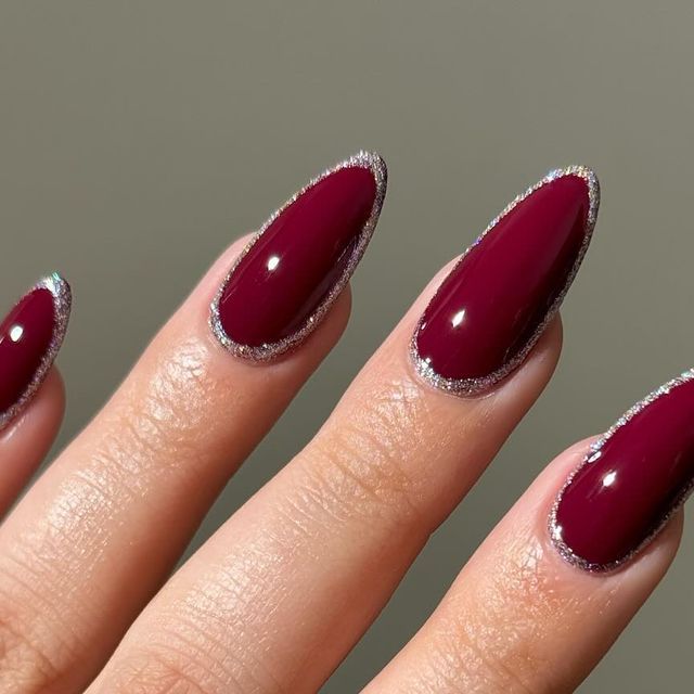 Chic Elegance: Deep Burgundy Almond Nails with Sparkling Silver Tips