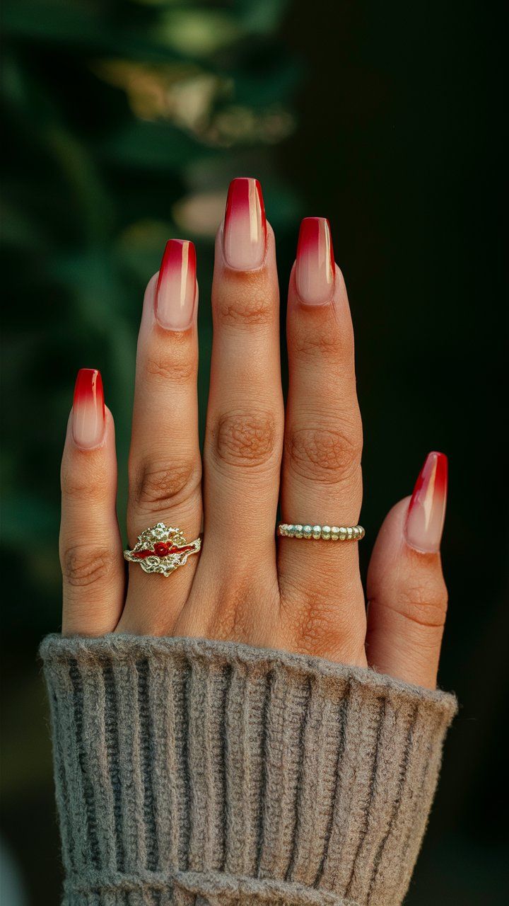 Bold Red Ombre Nails: A Chic Fashion Statement Enhanced by Elegant Accessories.