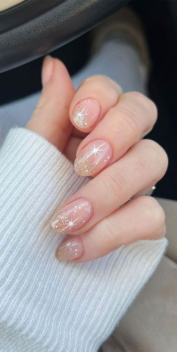 Chic Gradient Glitter Nude Nails with Glamorous Star Accents.