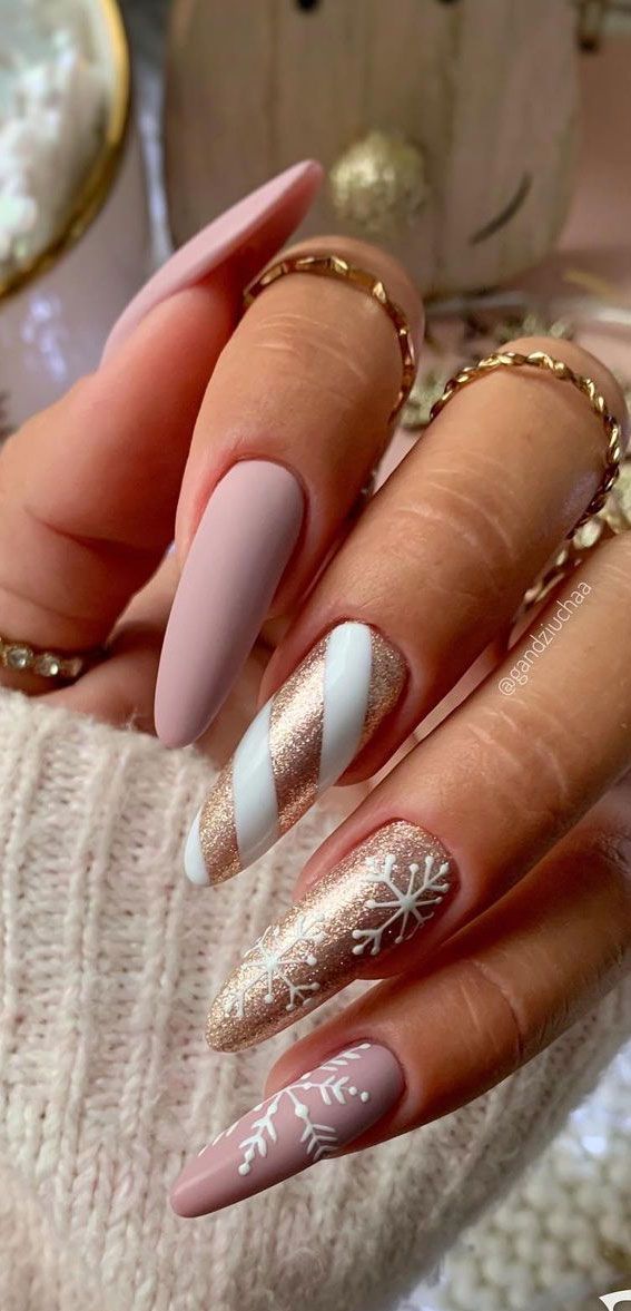 Sophisticated Winter Nail Design with Matte, Glitter, and Striped Accents.