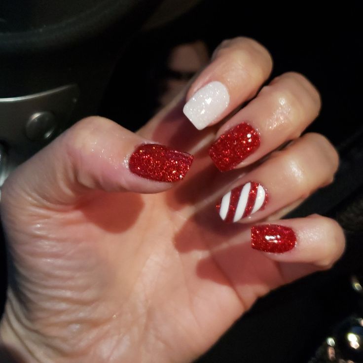 Vibrant Festive Nail Design: Bold Red Glitter and Candy Cane Stripes for Holiday Cheer