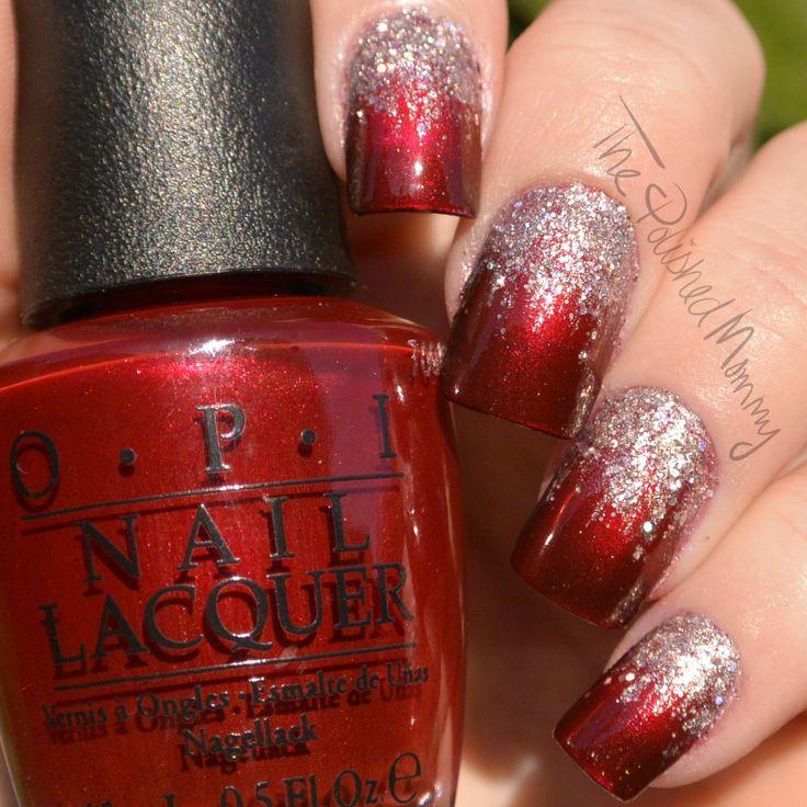 Glamorous Gradient Nail Design: Deep Red Base with Shimmering Silver Glitter Tips for Festive Elegance.