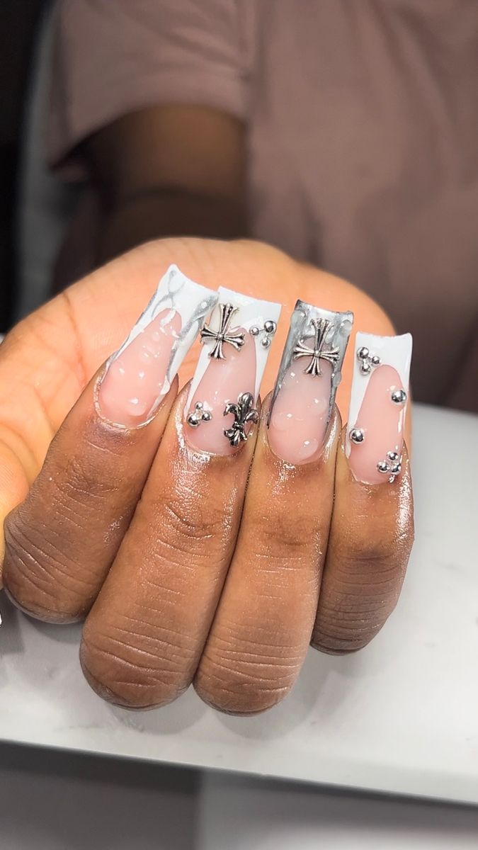 Chic Elegant Nail Design: Soft Pink and Clear Tips with Glamorous Metallic Silver Accents.