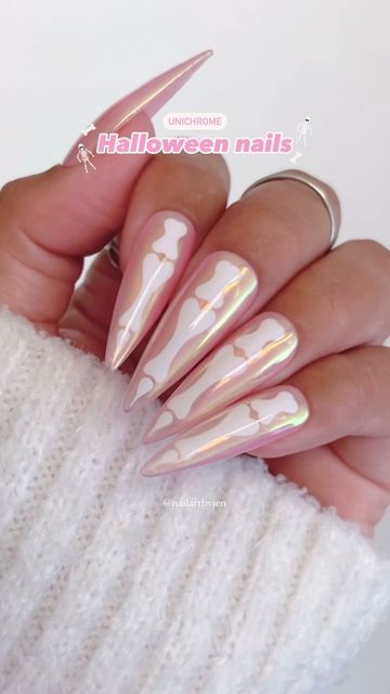 Playful Pastel Bone Pattern Halloween Nails with Iridescent Finish.