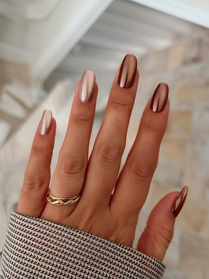 Sophisticated Metallic Nail Design with Glossy Warm Hues.