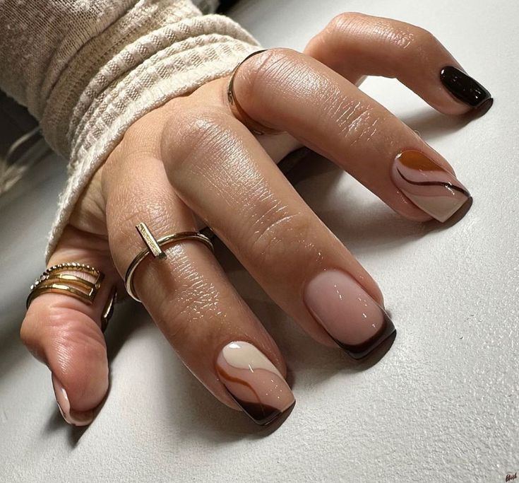 Chic Nail Design with Abstract Shapes in Neutral and Dark Tones.