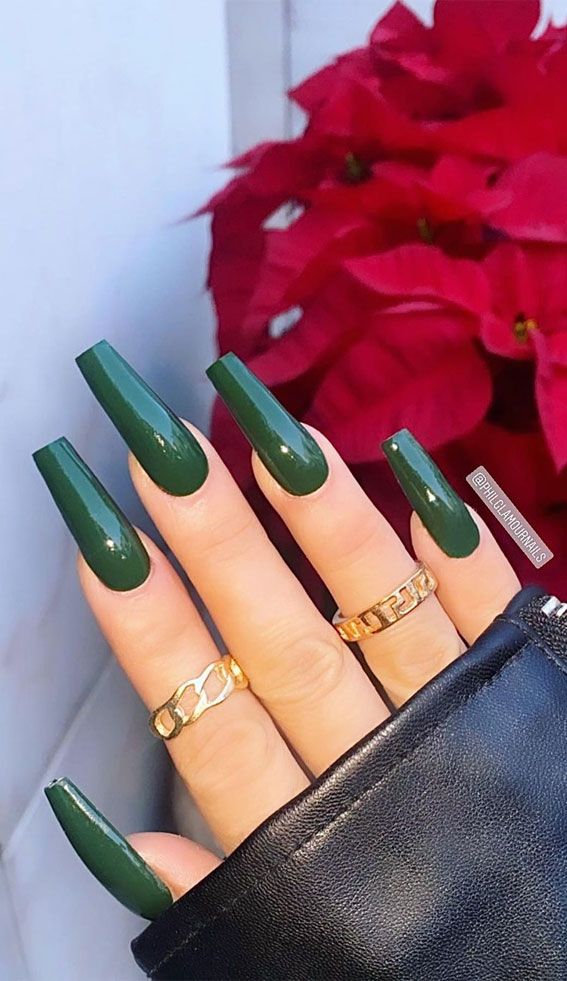 Chic Green Nail Design Enhanced by Elegant Gold Rings for Any Occasion.