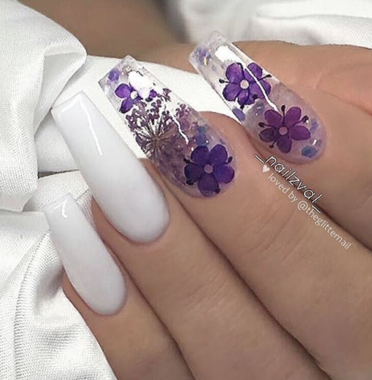 Elegant Floral Nail Design: Stunning Clear and White Polished Nails with Delicate Purple Flower Accents.